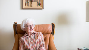 old woman sitting in chair