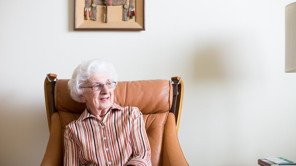 old woman sitting in chair