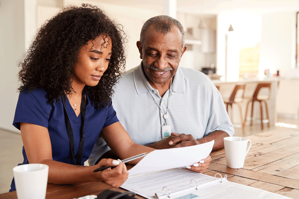 two people review a paper with Coping Strategies for Caregivers
