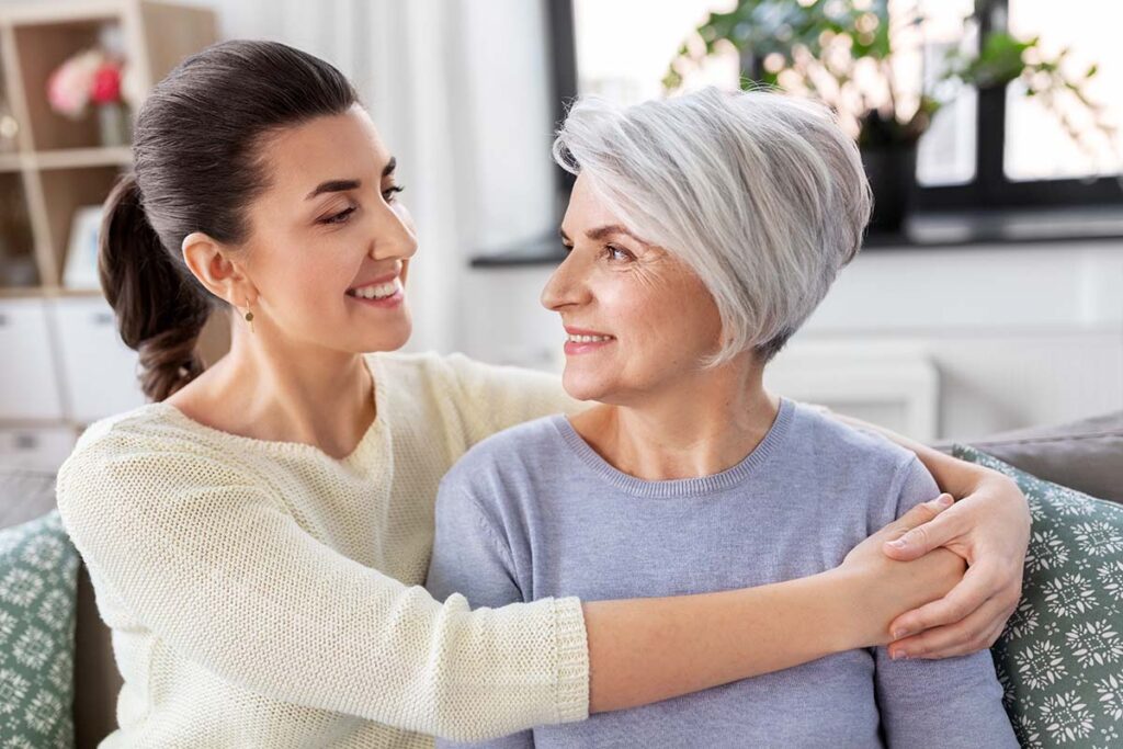 senior and daughter embracing after finding out how to determine level of care for elderly