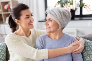 senior and daughter embracing after finding out how to determine level of care for elderly