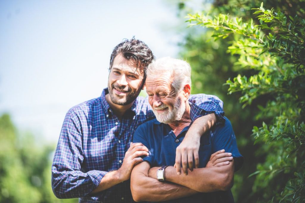 a person hugs an elderly person possibly after discussing senior care for parents
