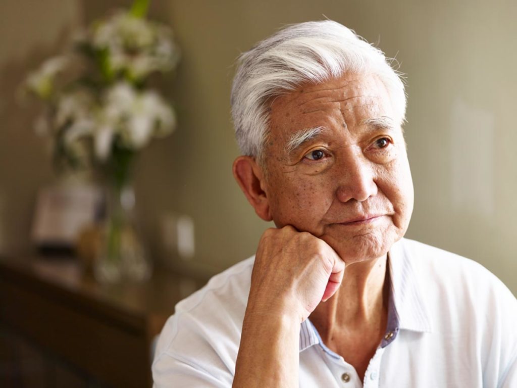 a person looks sad as they experience senior loneliness