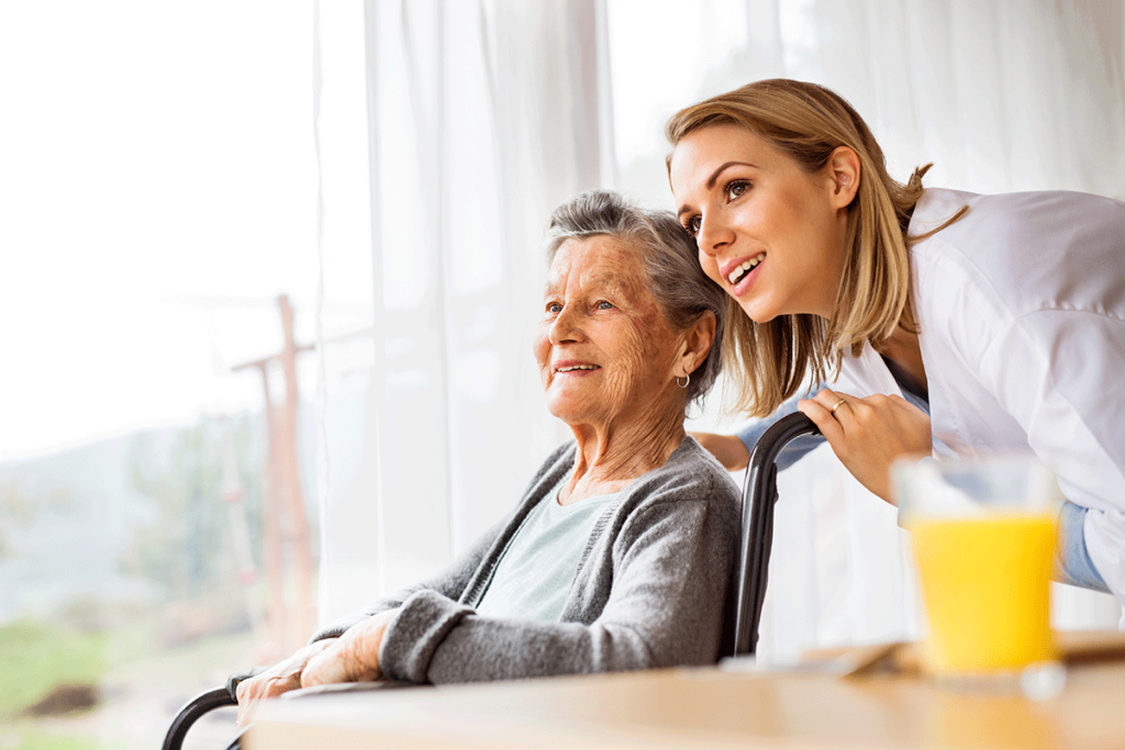a caregiver and a senior share a moment as they consider the differences between Hospice vs. Respite Care