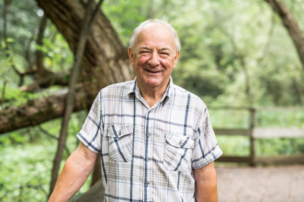 Happy man at assisted living age considering senior living