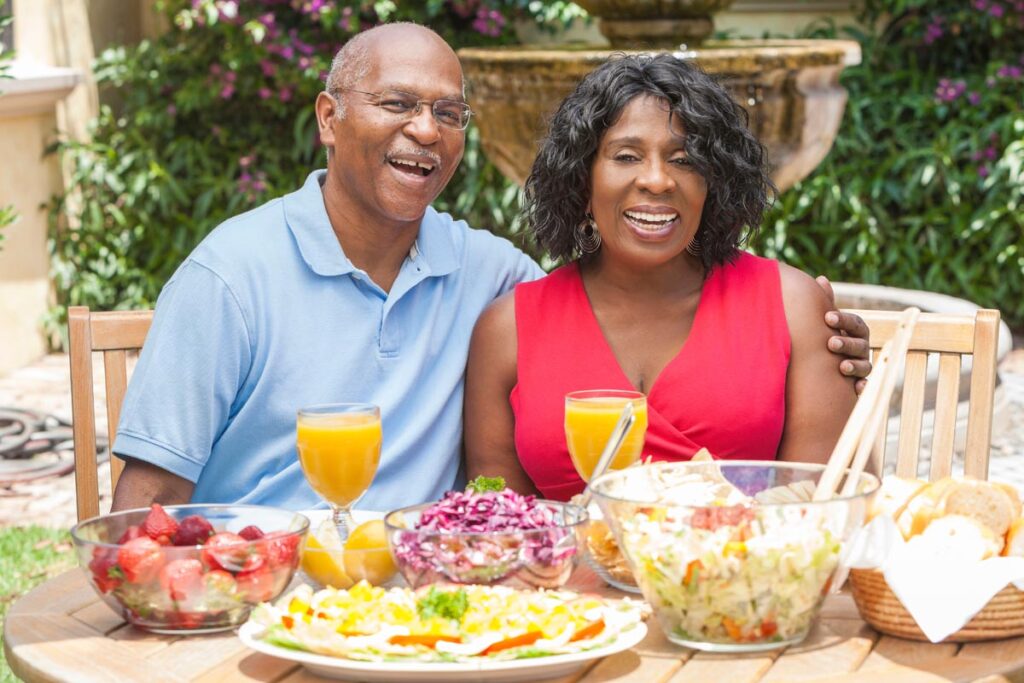 Two people eating and discussing how to improve nutrition in the elderly