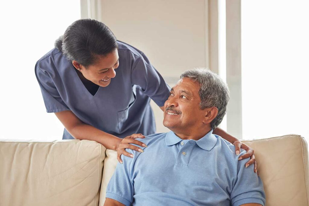 Older adult discussing cost of assisted living in austin tx with compassionate caretaker