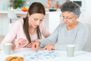 Senior and caregiver talk about finding a senior memory care center